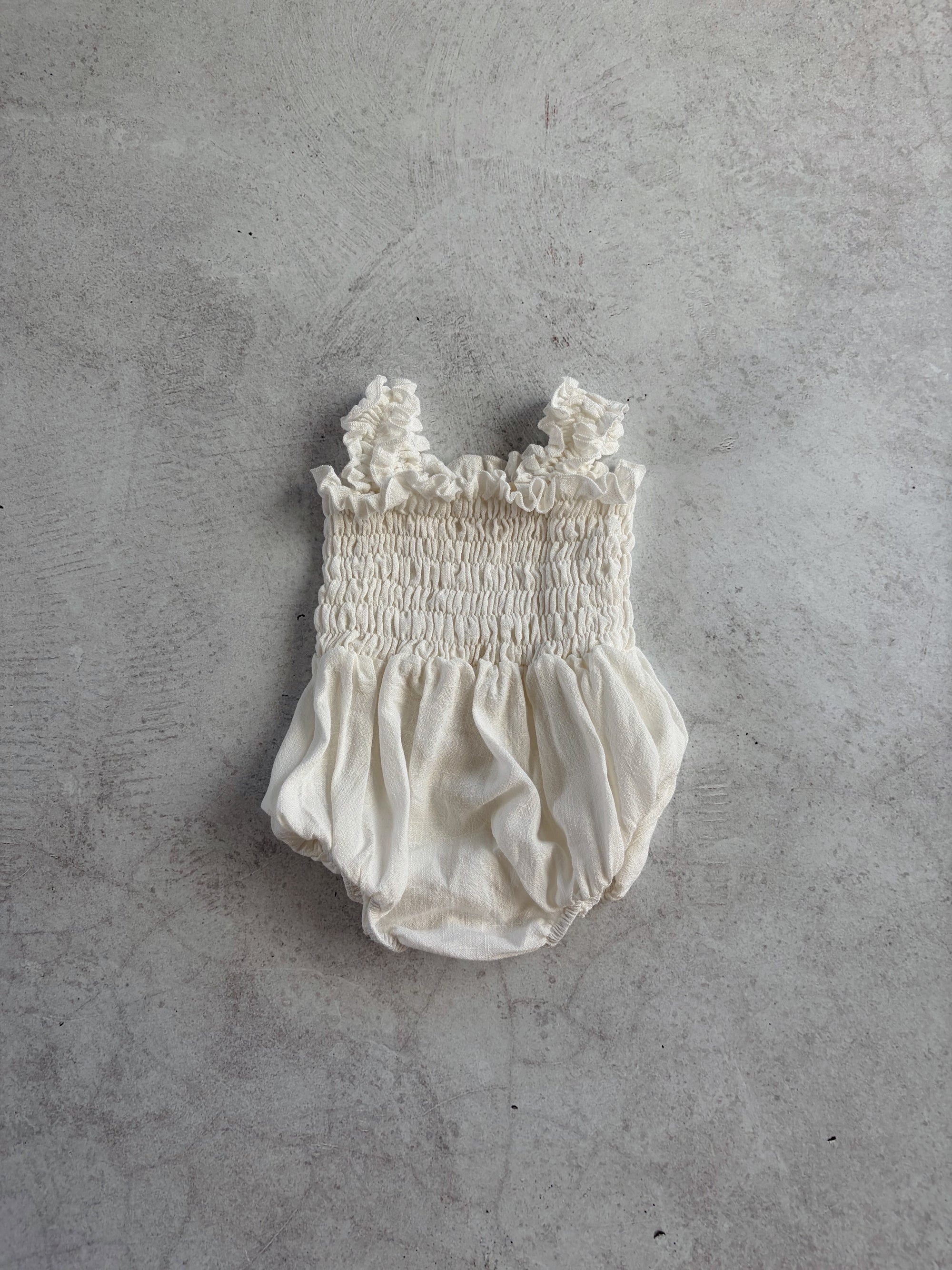 RUFFLE ROMPER - MILK