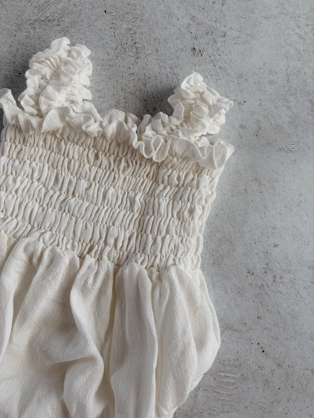 RUFFLE ROMPER - MILK